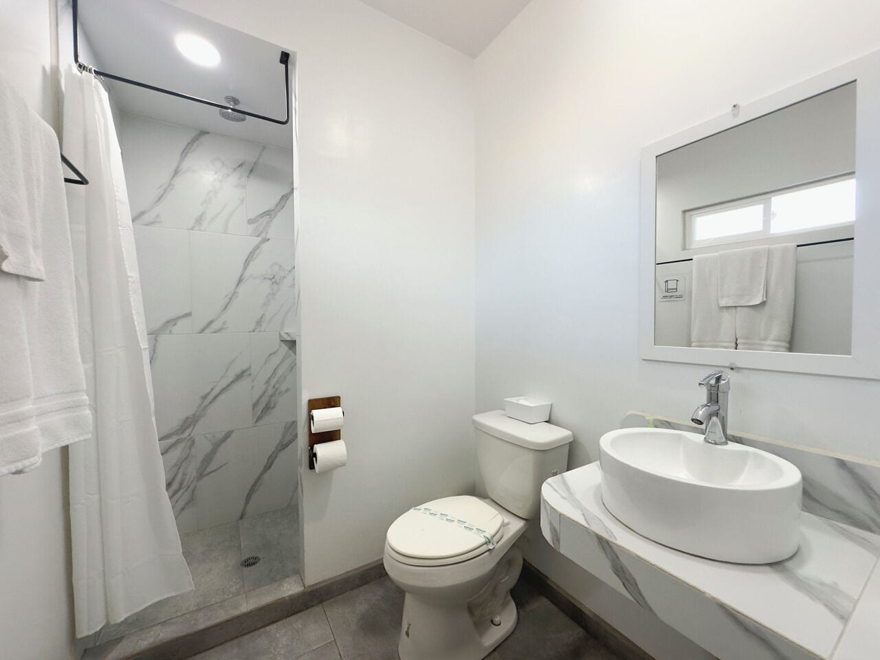Shower, rainfall showerhead, hair dryer, towels
