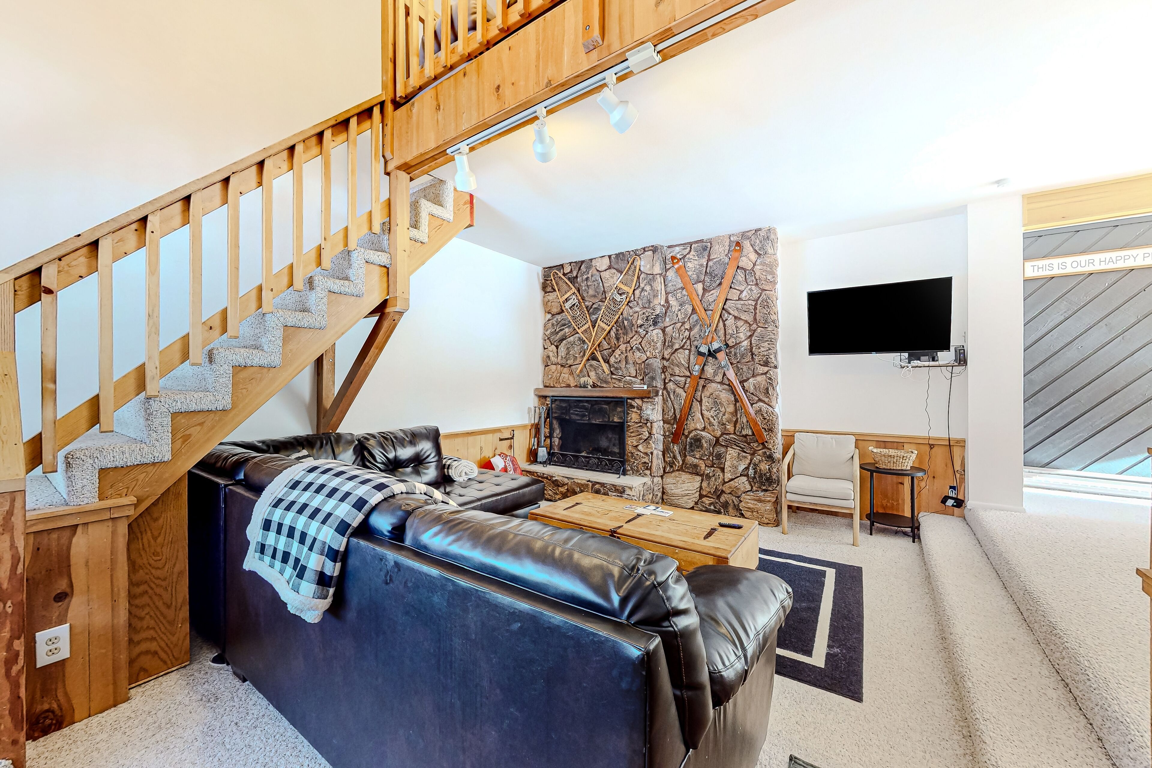 Pine-lined condo with wood fireplace, jetted tub, & balcony - walk to lifts