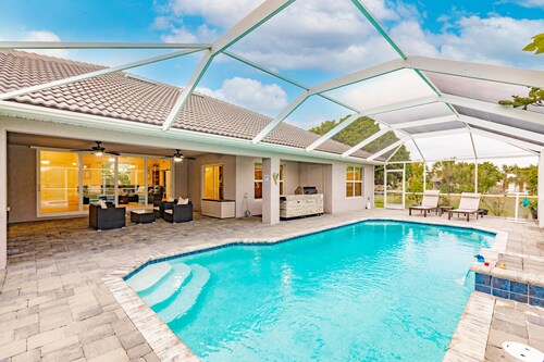 Delightful home near beaches with heated pool, patio, lanai, grill, & streaming