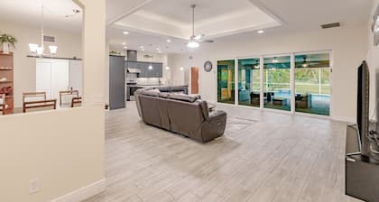 Delightful home near beaches with heated pool, patio, lanai, grill, & streaming