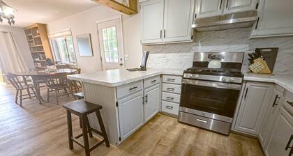 Incredible lakefront house with cottages, dock, fire pit, decks, & amazing views