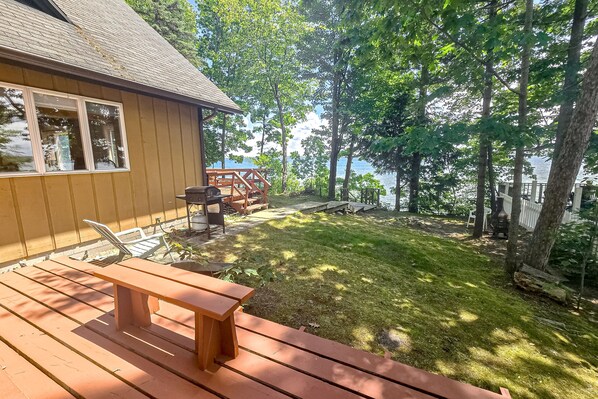 Terrace/patio - Incredible lakefront house with cottages, dock, fire pit, decks, & amazing views (Topinabee)