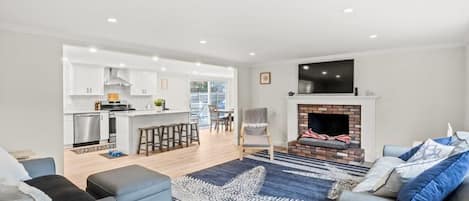 TV, fireplace, books