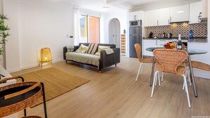 A modern apartment with a living room, dining area, and kitchen. - Salt and Sea Apartment, Sea View, Free Wi Fi (Costa Adeje)