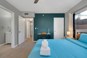 A hotel room with a bed, a desk, a chair, and a window. - The Swing by Velo (Tucson)