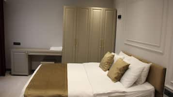 Deluxe Twin Room, 1 Bedroom | Minibar, in-room safe, soundproofing, iron/ironing board