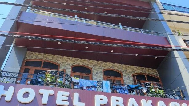 A multi-story building with a sign reading "HOTEL PRAKASHI". - Hotel Prakash By GRB (Rishikesh)