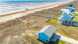 A coastal property with a beach view, wooden walkways, and a large house with a balcony. - Cape Allswell - Life is Good, Sun, Sand & Surf! (Freeport)