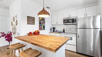 Microwave, oven, coffee/tea maker, cookware/dishes/utensils