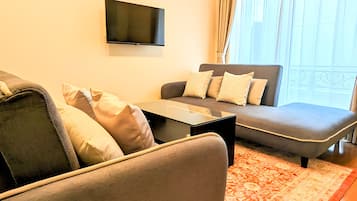 Family Condo, Non Smoking, Kitchen (B) | Living area | 32-inch flat-screen TV with digital channels