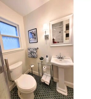 Shower, hair dryer, towels, soap