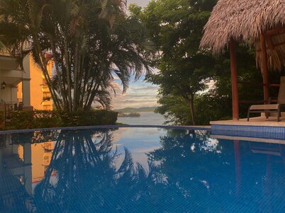 Amazing Ocean view Top Condo overlooking Playa Flamingo. Guarantee: best Sunsets