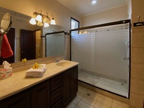 Shower, hair dryer, towels, soap