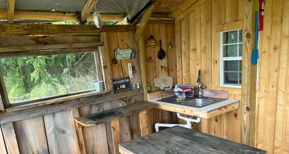 Our Rustic off grid Serenity Camp is 190 sq ft and 2300 feet through the woods.