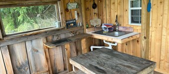Our Rustic off grid Serenity Camp is 190 sq ft and 2300 feet through the woods.