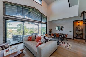 TV, books - Exclusive Tree House with Double-Deck Porch, Fire Pit & Lake Views (Spicewood)