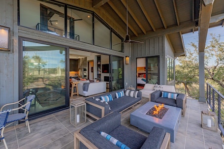 Terrace/patio. Lola's Lakefront: 3-Bed Treehouse with Porch, Fire Pit & Year-Round Fun