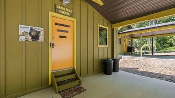 Welcome to Backwoods Vacation Rental, featuring a cozy entrance with a wooden ceiling and a window.
