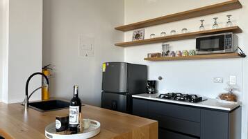 Fridge, microwave, cookware/dishes/utensils