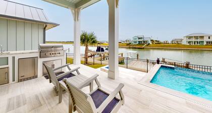Waterfront home with private pool, community kayaks, grill, open layout, & AC