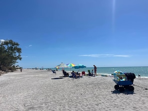 On the beach, sun-loungers, beach towels