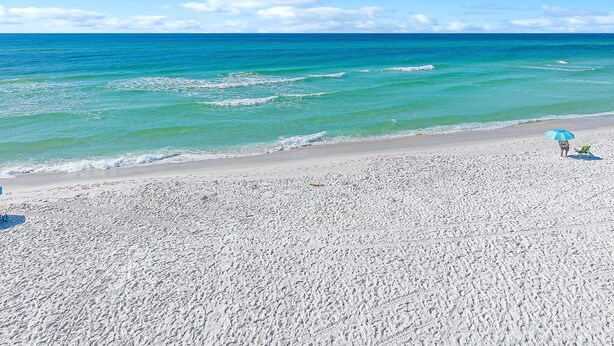 A beach with clear turquoise water and a sandy shore. - KC Coastal 30A Inlet Beach • POOL • 1st Floor • KING • 2 Minute Walk to Beach (Inlet Beach)