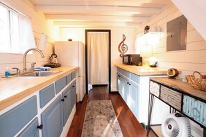 Fridge, stovetop, cookware/dishes/utensils, paper towels