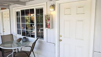 A white door with a sign reading "NUTHATCH" above it.