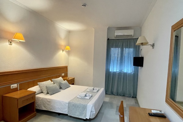 Standard Double or Twin Room | In-room safe, desk, laptop workspace, blackout drapes