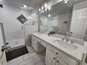 Shower, hair dryer, towels, soap
