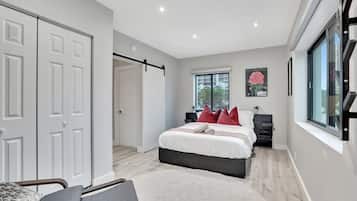 1 bedroom, desk, iron/ironing board, travel crib