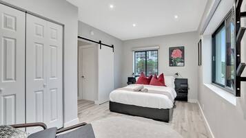 1 bedroom, desk, iron/ironing board, travel crib