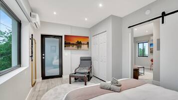 1 bedroom, desk, iron/ironing board, travel crib