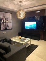 Family Suite, 2 Bedrooms, City View | Living area | Smart TV, offices