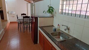 Fridge, stovetop, electric kettle, cookware/dishes/utensils