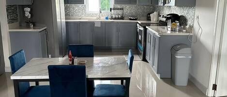 Fridge, microwave, stovetop, coffee/tea maker