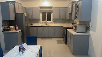 Fridge, microwave, stovetop, coffee/tea maker