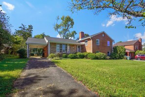 A two-story brick house with a covered porch, a driveway, and a well-maintained lawn. - Family friendly home, sleeps 8, close to DC attractions.
New kitchen.  (Alexandria)