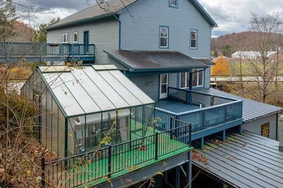 Dog-friendly, riverfront home with games galore, pool, & mountain view