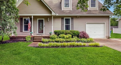 Cozy custom-furnished home with yard, firepit, children's items, AC, & office