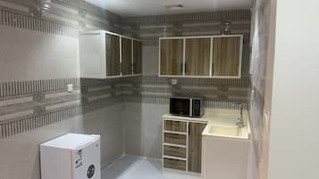 Suite Deluxe | Cocina privada | Refrigerador y microondas