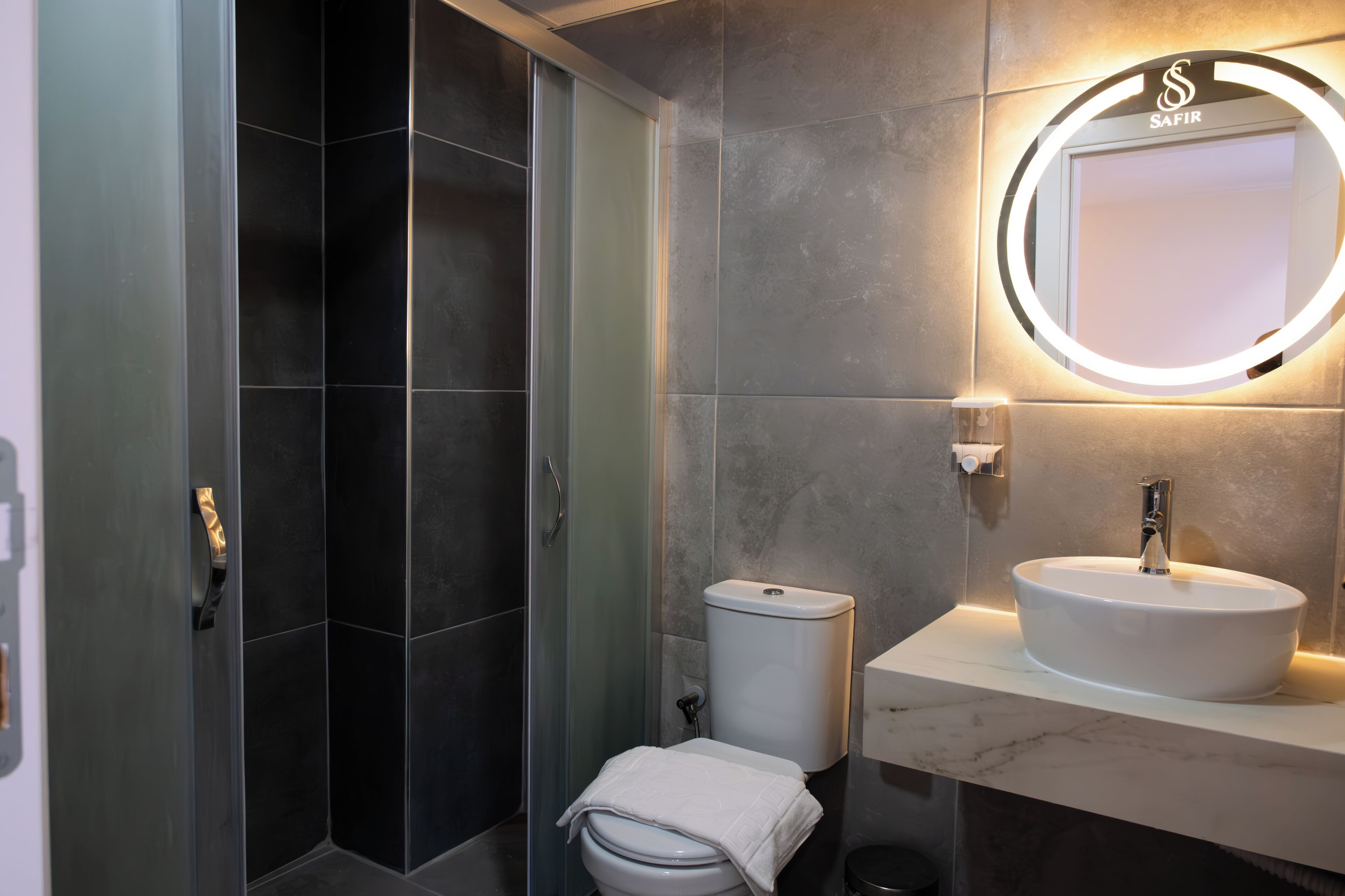 Eco-friendly toiletries, hair dryer, towels, soap