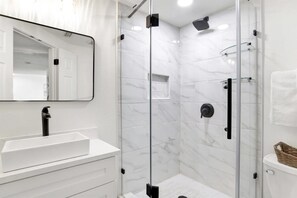 Shower, hair dryer, towels, toilet paper