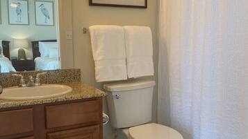 Shower, hair dryer, towels, soap