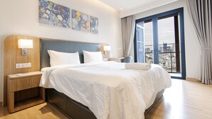 A modern hotel room with a large bed, wooden nightstands, and a city view through the window. - Le Places ZENITY Apartment District 1 (Ho Chi Minh City)