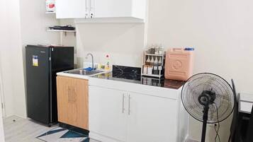 Fridge, electric kettle, cookware/dishes/utensils
