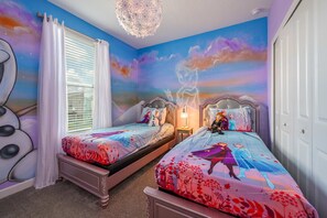 A bedroom with two beds, a chandelier, and a mural on the wall. - Last Minute Disney! Private Pool, Hot Tub & Themed Bedrooms. Book Now! #104249 (Orlando)