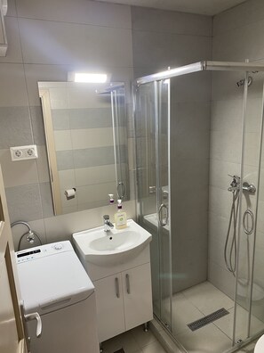 Shower, towels, soap, toilet paper