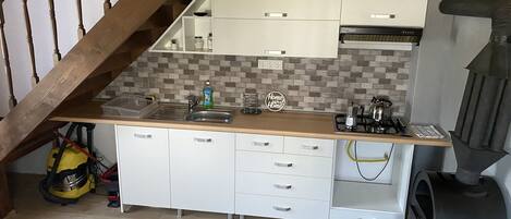 Fridge, microwave, stovetop, coffee/tea maker