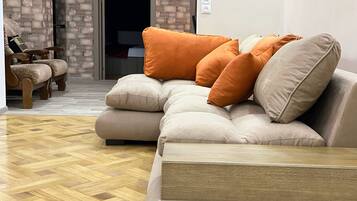 Deluxe Apartment, 4 Bedrooms | Living area | Flat-screen TV